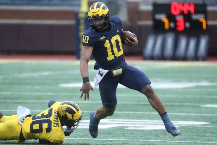 Michigan Wolverines quarterback Alex Orji runs with the ball.